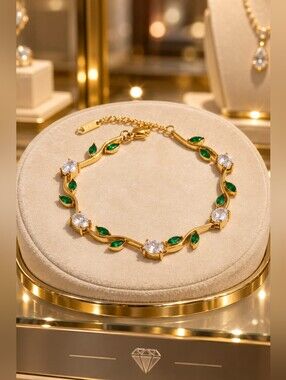 Gold Bracelet with Green Leaf Accents and Clear Stones